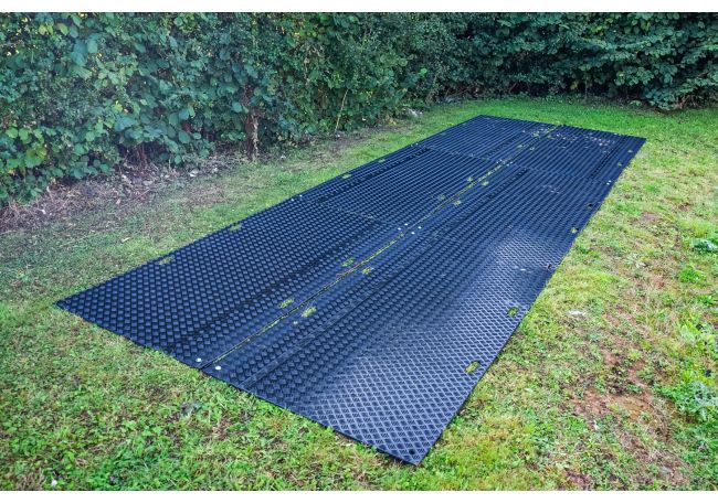 External ground protection mats protecting grass from machinery movement